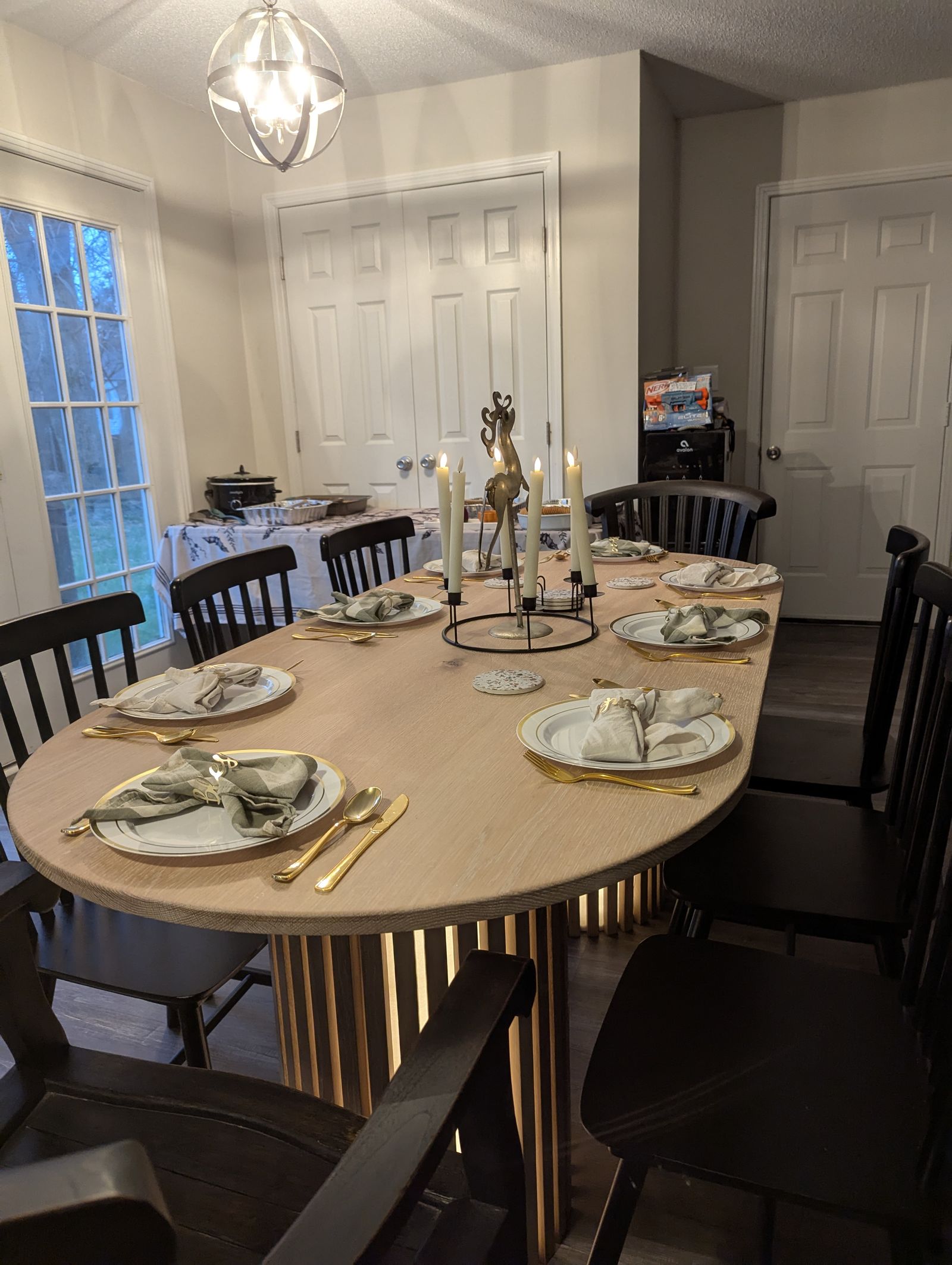 White oak fluted oval dining table in a client's dining room