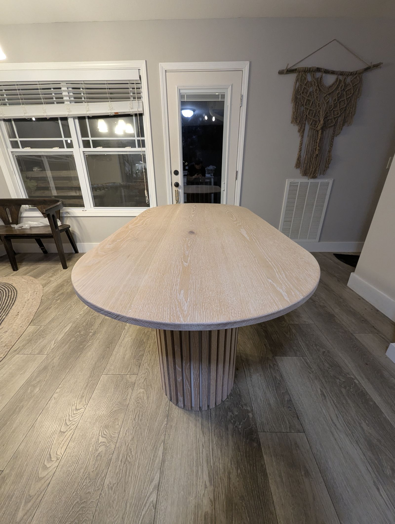 Close view of the white oak grain across the fluted tabletop